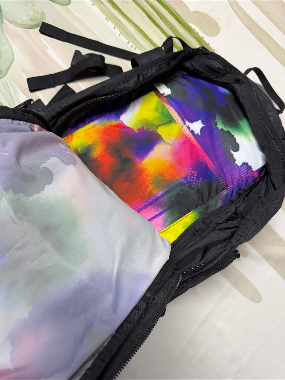 Dakine Heli Pro backpack features a black camouflage pattern and purple brandin - Picture 5 of 6